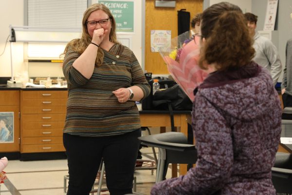 Science teacher Sarah Moonier reacts emotionally as her daughter, sophomore Katie Moonier, announces that she won Teacher of the Year. Moonier shared how special it was to have Katie help share the news. "It was really cool that my daughter got to be a part of it. When you're a teacher and your kid is in the building, it's a really special time as a teacher. You get to share so many experiences with your kid and see them grow up and everything, and so to be able to have her be a part of that, I know it's gonna be a good core memory," Moonier said.