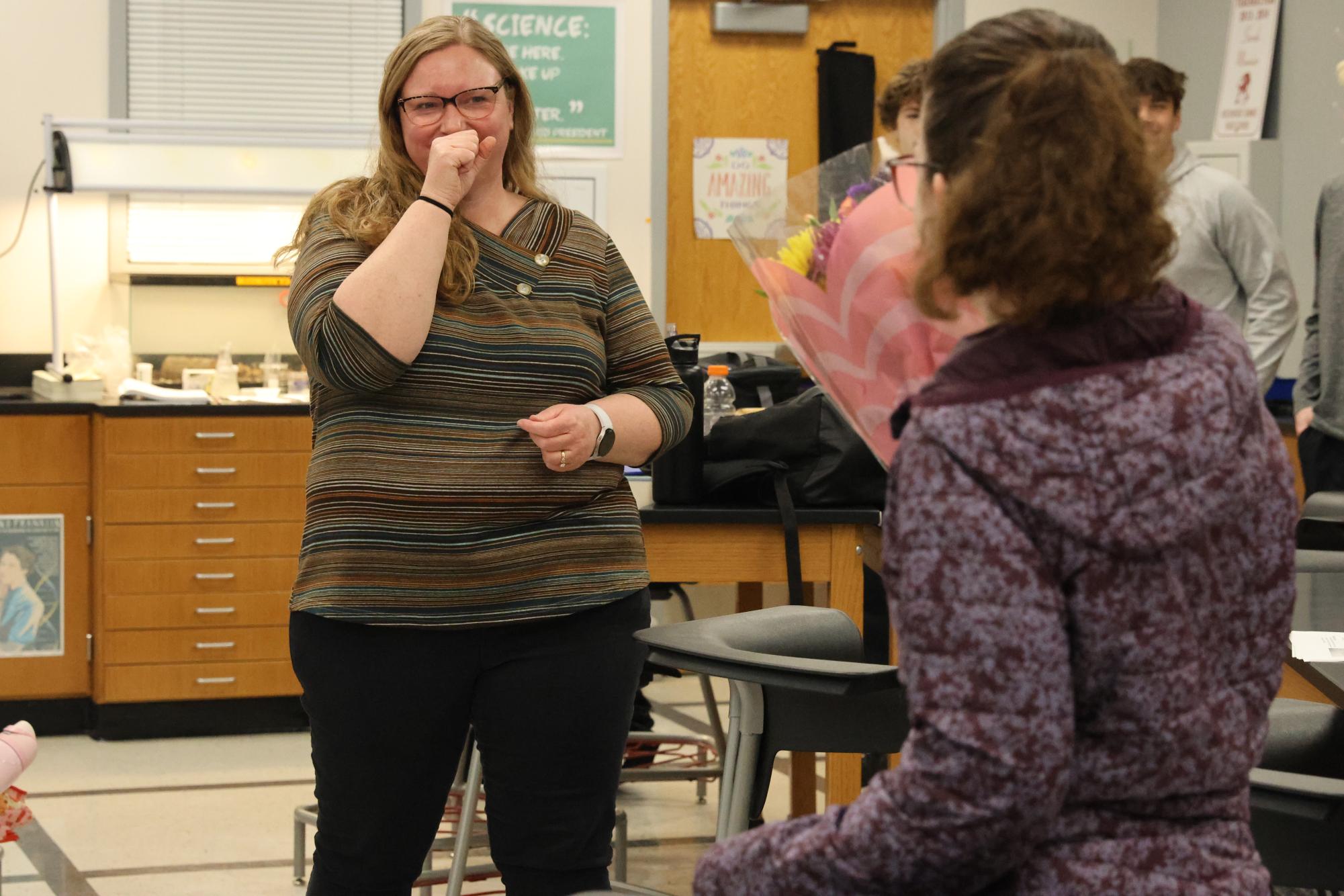 Science teacher Sarah Moonier reacts emotionally as her daughter, sophomore Katie Moonier, announces that she won Teacher of the Year. Moonier shared how special it was to have Katie help share the news. "It was really cool that my daughter got to be a part of it. When you're a teacher and your kid is in the building, it's a really special time as a teacher. You get to share so many experiences with your kid and see them grow up and everything, and so to be able to have her be a part of that, I know it's gonna be a good core memory," Moonier said.