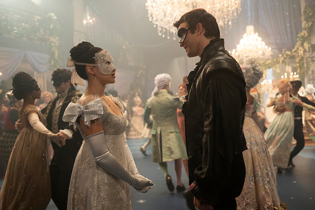 Sophie and Benedict conversate at Lady Violet Bridgerton’s masquerade ball. You can find the new season of “Bridgerton” on Netflix. (photo from E! News)
