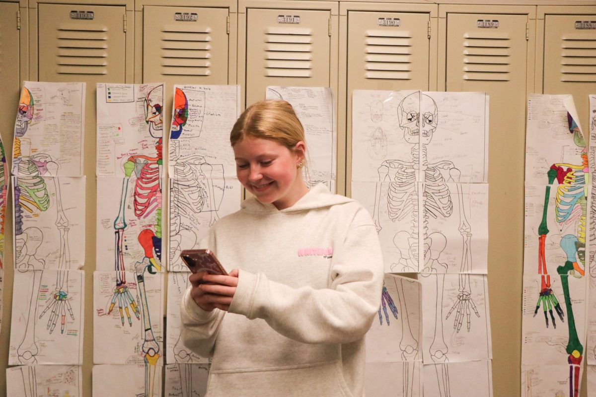 Junior Reilly Lechner texts on her phone.