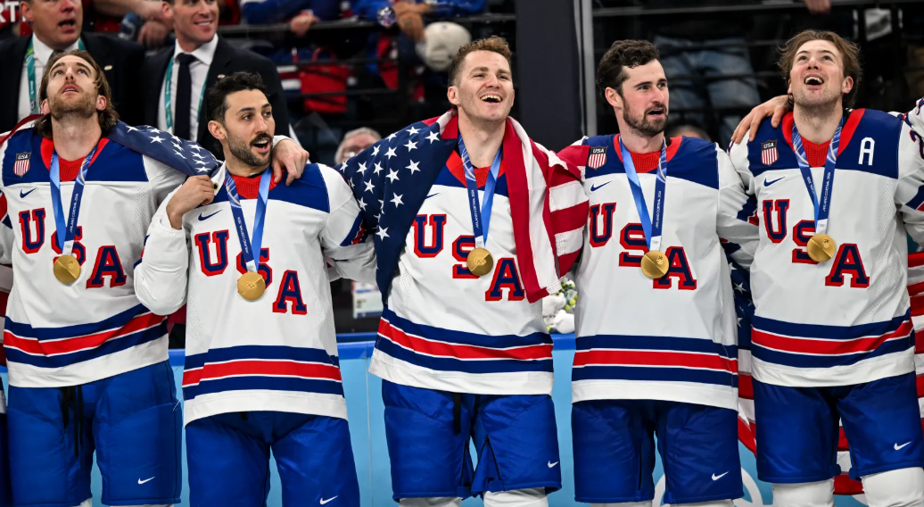 Team USA men's ice hockey players Noah Hanifin, Vincent Trocheck, St. Louis native Matthew Tkachuk, Dylan Larkin, and Charlie McAvoy celebrate their win. Donning the gold, the team beat Canada on Feb. 22 in overtime to secure first place. (photo from Newsweek)