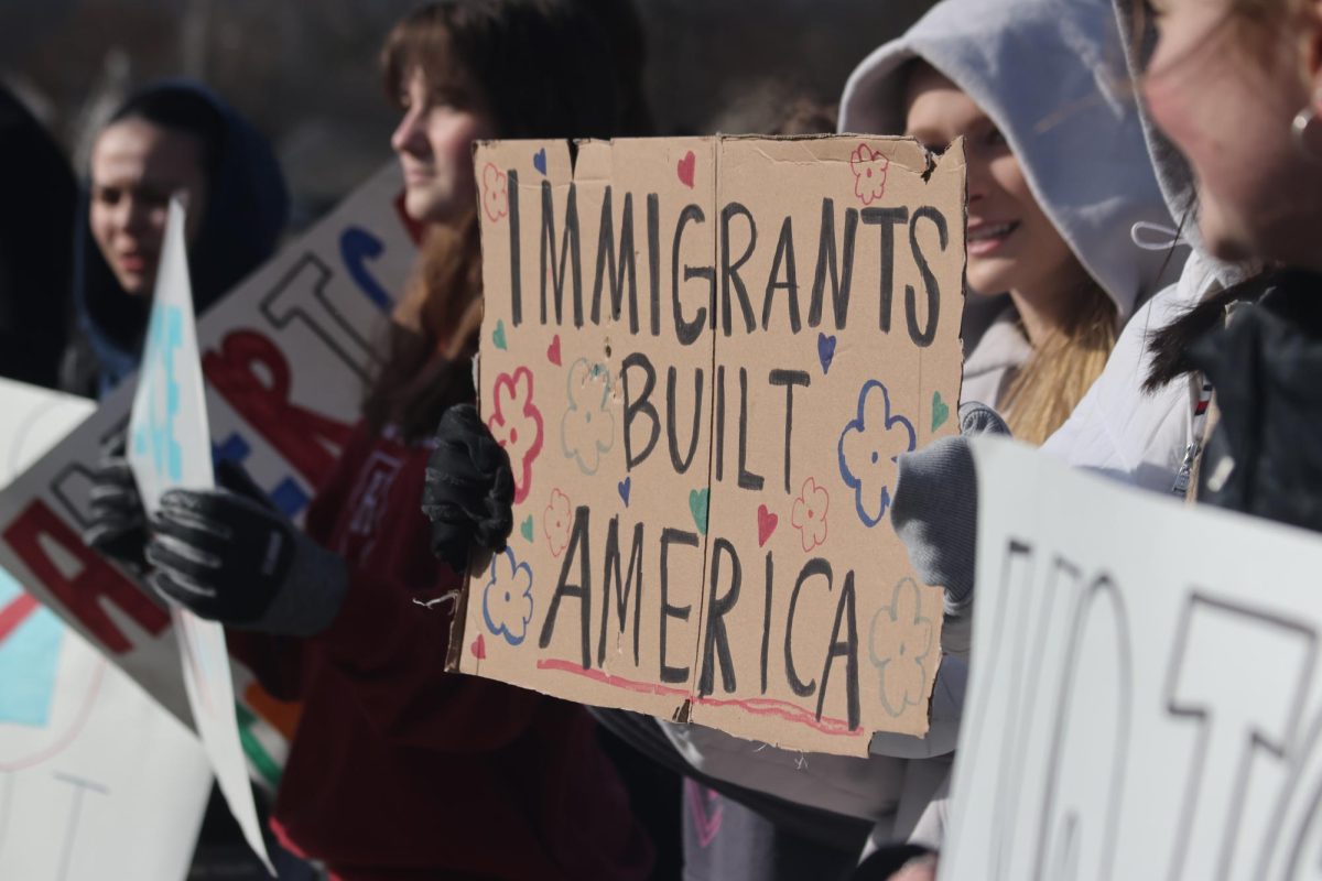 On Hawkins, students protest the increased presence of Immigrations and Customs Enforcement (ICE) in the United States. The protest took place before the first bell of a late start on Feb. 23. 