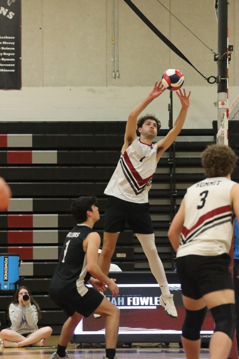 Senior Joe Lockey (1) sets the ball to senior Eben Lindsey (3). The game took place on April 16,  the Falcons won on senior night to the Pattonville Pirates 3-1.