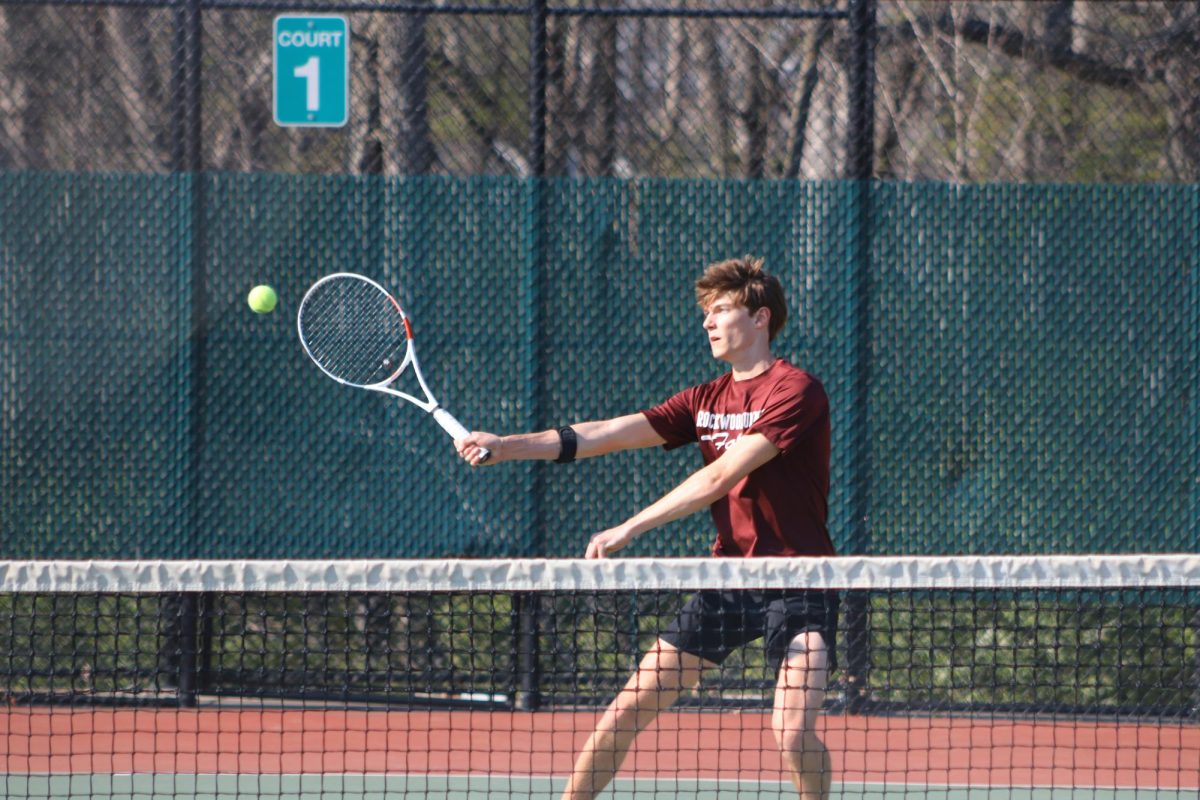 Waiting for the ball, senior Max Otto holds up his racket. Summit played against Parkway South on April 8.
